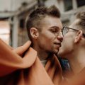 A match made in Stockholm. Two queer men passionately kiss.