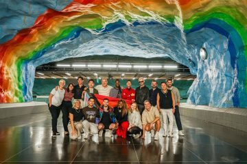 Our pride party under a rainbow mural at Stadion Station.