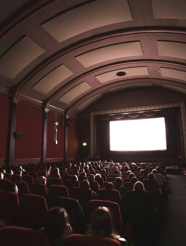 A dimly lit cinema screening during Cinema Queer in Stockholm.