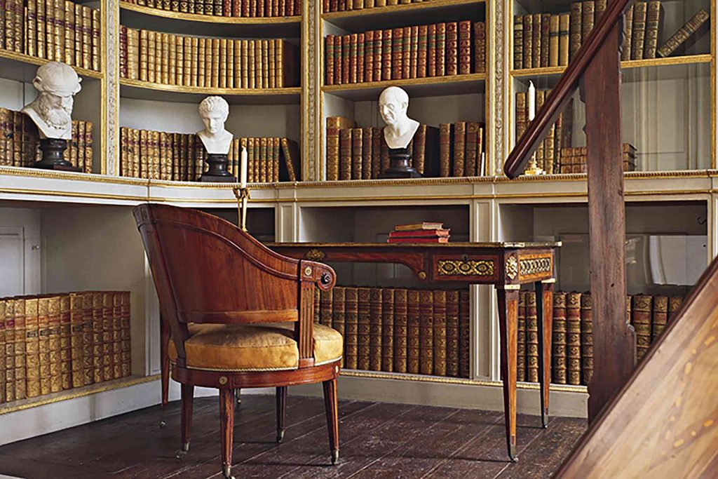 Library at the Gustav III's Pavilion in Haga Park, with busts, books and antique desk and chair